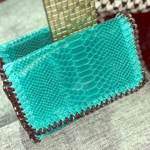 Teal clutch !! Never worn! With strap or No strap
